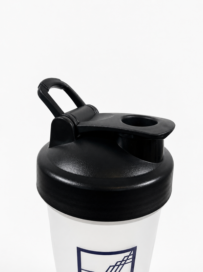 Close-up of a shaker bottle lid with a black flip-top handle and a clear bottle body featuring a dark purple VUUR logo, set against a plain white background.